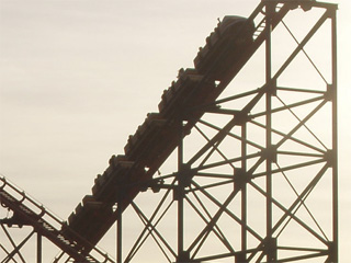 Cars ascending a rollercoaster
