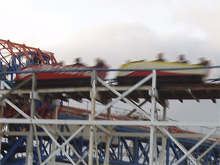Speeding cars on a rollercoaster