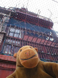 Mr Monkey looking up at the upper stories of the tower top