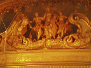 The frieze and motto above the organ