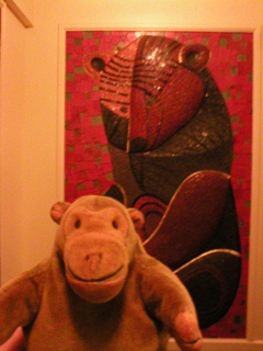 Mr Monkey looking at a mosaic bear