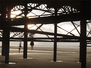 The lighthouse across the harbour