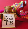Monkey with dragon and 'good luck' scroll