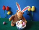 Monkey with bunny ears and eggs
