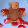 Monkey with small red hearts